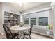 Cozy breakfast nook with a round table, built-in bench seating, and ample natural light at 4953 W Acoma Dr, Glendale, AZ 85306