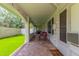 Spacious covered patio featuring brick flooring, outdoor seating, and ample room for relaxing at 4953 W Acoma Dr, Glendale, AZ 85306