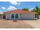 Charming single-story home featuring a red tile roof, arched windows, and a low-maintenance desert landscape at 4953 W Acoma Dr, Glendale, AZ 85306