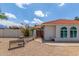 Charming single-story home featuring a red tile roof, arched windows, and a low-maintenance desert landscape at 4953 W Acoma Dr, Glendale, AZ 85306