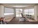 Bright home gym with free weights and view of the sparkling pool at 4953 W Acoma Dr, Glendale, AZ 85306