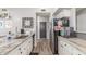Functional kitchen featuring granite countertops, stainless steel appliances, and ample cabinet space at 4953 W Acoma Dr, Glendale, AZ 85306