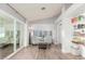 Bright, airy living room with light gray walls, sliding glass doors, and stylish seating arrangement at 4953 W Acoma Dr, Glendale, AZ 85306