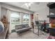 Office with a gray sofa and large arched window at 4953 W Acoma Dr, Glendale, AZ 85306