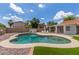 Inviting backyard pool with manicured turf, lounge chairs, and partial shade at 4953 W Acoma Dr, Glendale, AZ 85306