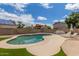 Backyard pool with lounge chairs and lush landscaping at 4953 W Acoma Dr, Glendale, AZ 85306