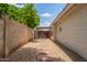A peaceful side yard with stepping stones and gravel, offering a serene outdoor escape at 4953 W Acoma Dr, Glendale, AZ 85306
