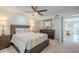 Cozy bedroom with a ceiling fan, dresser, and a view into the home's living spaces at 5201 N 24Th St # 107, Phoenix, AZ 85016