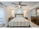 Bedroom featuring neutral tones, wood accents, and ample lighting at 5201 N 24Th St # 107, Phoenix, AZ 85016