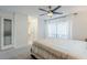 Bright bedroom featuring neutral walls, window, and an ensuite bathroom at 5201 N 24Th St # 107, Phoenix, AZ 85016