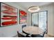 Cozy dining area featuring a marble table, modern lighting, and artwork on the walls at 5201 N 24Th St # 107, Phoenix, AZ 85016