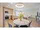 Stylish living area featuring a dining table, a modern kitchen, and an open-concept design at 5201 N 24Th St # 107, Phoenix, AZ 85016