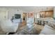 Open-concept living area with hardwood floors, a modern kitchen, and comfortable seating arrangements at 5201 N 24Th St # 107, Phoenix, AZ 85016