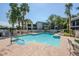 Beautiful community swimming pool with blue water, lounge chairs, and manicured landscaping at 5201 N 24Th St # 107, Phoenix, AZ 85016