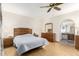 Spacious bedroom with a ceiling fan, and wood-look floors at 5210 W Ironwood Dr, Glendale, AZ 85302