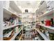 Walk-in pantry with extensive shelving for optimal storage at 5210 W Ironwood Dr, Glendale, AZ 85302