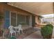 Covered patio area with outdoor seating offering a cozy space for relaxation at 5210 W Ironwood Dr, Glendale, AZ 85302