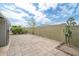 Large backyard patio showcases a privacy wall, landscaping, and beautiful pavers at 5735 E Mcdowell Rd # 67, Mesa, AZ 85215