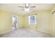 This bedroom features neutral carpet and a lighted ceiling fan for additional comfort at 5735 E Mcdowell Rd # 67, Mesa, AZ 85215