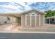 Inviting home featuring arched windows and a covered parking area providing both style and convenience at 5735 E Mcdowell Rd # 67, Mesa, AZ 85215