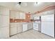 Functional kitchen equipped with modern appliances and lots of cabinet storage at 5735 E Mcdowell Rd # 67, Mesa, AZ 85215