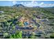 High aerial view of the desert community, home with pool and desert landscape nestled against the mountains at 6524 E Rockaway Hills Dr, Cave Creek, AZ 85331