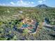 Beautiful aerial shot of desert home with private pool and desert landscaping, showcasing the expansive desert views at 6524 E Rockaway Hills Dr, Cave Creek, AZ 85331