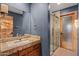 Bathroom with granite countertop and luxurious glass shower at 6524 E Rockaway Hills Dr, Cave Creek, AZ 85331