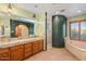 Bathroom featuring dual sinks, shower, and a tub at 6524 E Rockaway Hills Dr, Cave Creek, AZ 85331