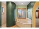 Bathroom features a bathtub, shower, and large window at 6524 E Rockaway Hills Dr, Cave Creek, AZ 85331