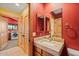 Bathroom with a vanity and a view of the washer and dryer at 6524 E Rockaway Hills Dr, Cave Creek, AZ 85331