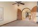 Bedroom view to kitchen through decorative archway at 6524 E Rockaway Hills Dr, Cave Creek, AZ 85331