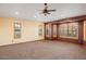 Bedroom has carpet, three windows, and neutral color scheme at 6524 E Rockaway Hills Dr, Cave Creek, AZ 85331