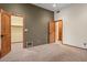 Spacious bedroom with carpet, wooden trim, doors and closet, and a two-tone paint design at 6524 E Rockaway Hills Dr, Cave Creek, AZ 85331