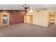 Open layout bedroom with carpet, wood doors, and a walk-in closet at 6524 E Rockaway Hills Dr, Cave Creek, AZ 85331
