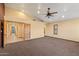 Spacious bedroom has neutral color scheme, carpet, and doors at 6524 E Rockaway Hills Dr, Cave Creek, AZ 85331