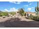 Charming desert home featuring a well-manicured front yard, desert landscaping, and a welcoming front entry at 6524 E Rockaway Hills Dr, Cave Creek, AZ 85331