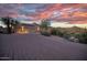 Desert home features 3-car garage, solar panels, and a circular driveway at 6524 E Rockaway Hills Dr, Cave Creek, AZ 85331