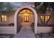 Iron gated entryway into the desert home with iron double doors at 6524 E Rockaway Hills Dr, Cave Creek, AZ 85331