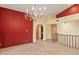 Hallway with travertine floors, arches, and wooden doors at 6524 E Rockaway Hills Dr, Cave Creek, AZ 85331
