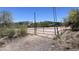 Fenced in Arizona horse property includes a covered area and desert landscaping at 6524 E Rockaway Hills Dr, Cave Creek, AZ 85331