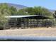 Covered stall area is part of this Arizona horse property with natural desert views at 6524 E Rockaway Hills Dr, Cave Creek, AZ 85331