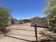 Fenced-in Arizona horse property with storage containers and desert vegetation at 6524 E Rockaway Hills Dr, Cave Creek, AZ 85331