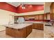 Open kitchen with granite island and wooden cabinets, great for entertaining and cooking at 6524 E Rockaway Hills Dr, Cave Creek, AZ 85331