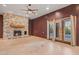 Inviting living room with stone fireplace, high ceilings, and natural light at 6524 E Rockaway Hills Dr, Cave Creek, AZ 85331