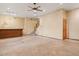 Open-concept living room with wet bar and staircase at 6524 E Rockaway Hills Dr, Cave Creek, AZ 85331