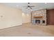 Spacious living room featuring a large stone fireplace and stylish flooring at 6524 E Rockaway Hills Dr, Cave Creek, AZ 85331
