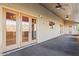 Inviting covered patio boasts dual doors and a ceiling fan at 6524 E Rockaway Hills Dr, Cave Creek, AZ 85331