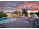 A desert home showcasing an outdoor fireplace, patio area, and swimming pool at 6524 E Rockaway Hills Dr, Cave Creek, AZ 85331