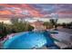 A spacious swimming pool features a basketball hoop and rock accents at 6524 E Rockaway Hills Dr, Cave Creek, AZ 85331